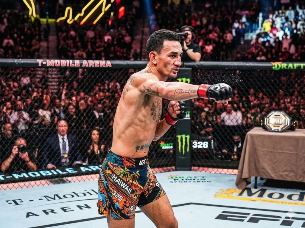 Max Holloway BMF champion throwing punch in UFC octagon 2026 — UFC 326 Las Vegas