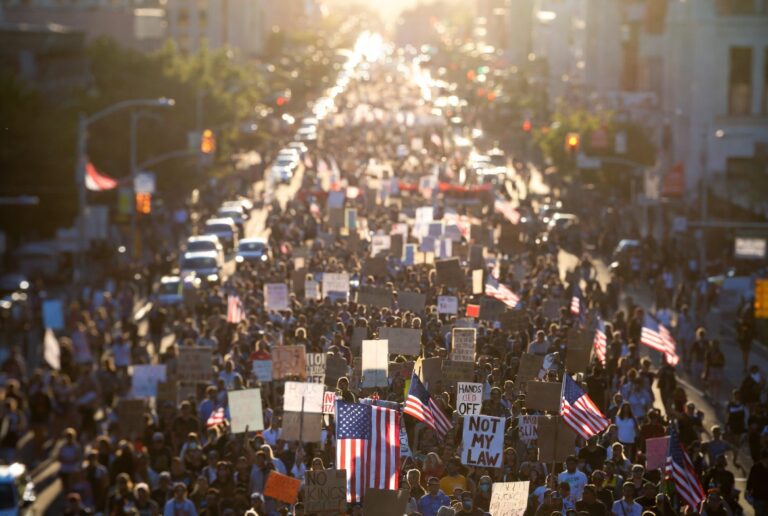 US protest wave 2026 — aerial drone view of millions of Americans marching in the No Kings nationwide protest on March 28 2026 across all 50 states, the largest political demonstration in US history against Trump administration policies