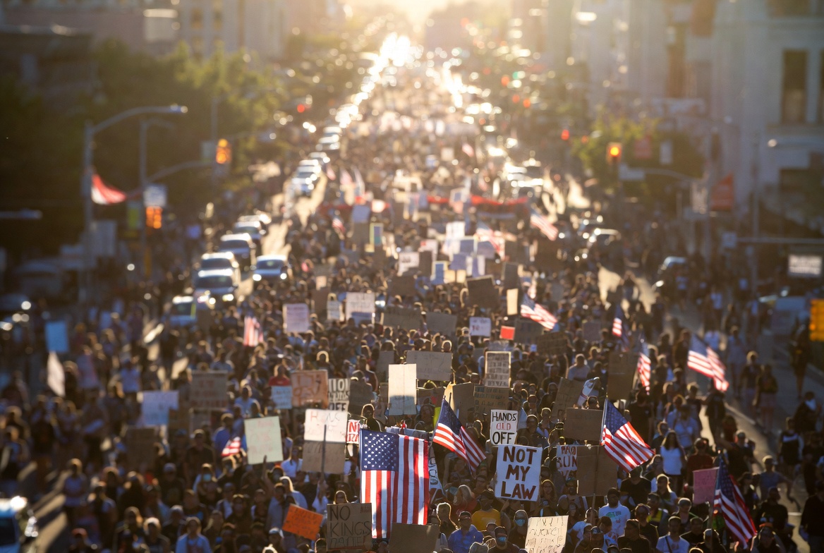 US protest wave 2026 — aerial drone view of millions of Americans marching in the No Kings nationwide protest on March 28 2026 across all 50 states, the largest political demonstration in US history against Trump administration policies