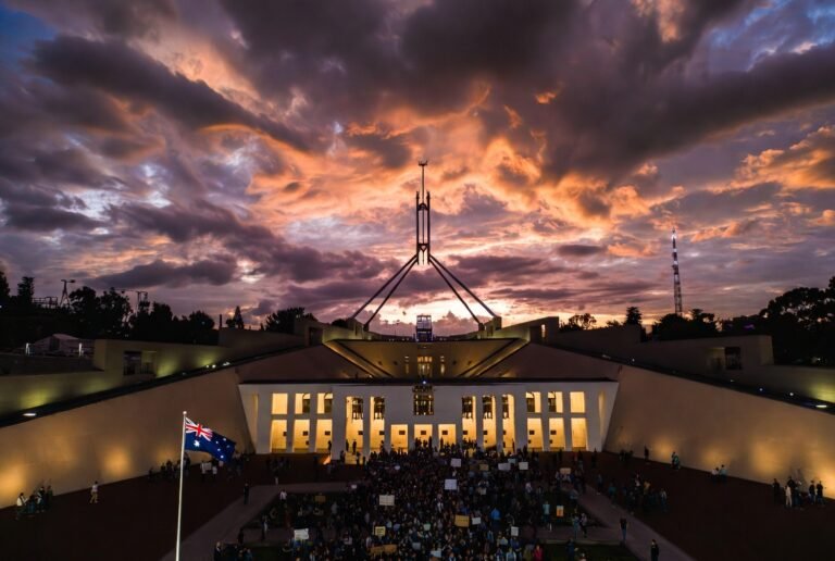 Protesters gather outside Parliament House Canberra during Australia political crisis 2026