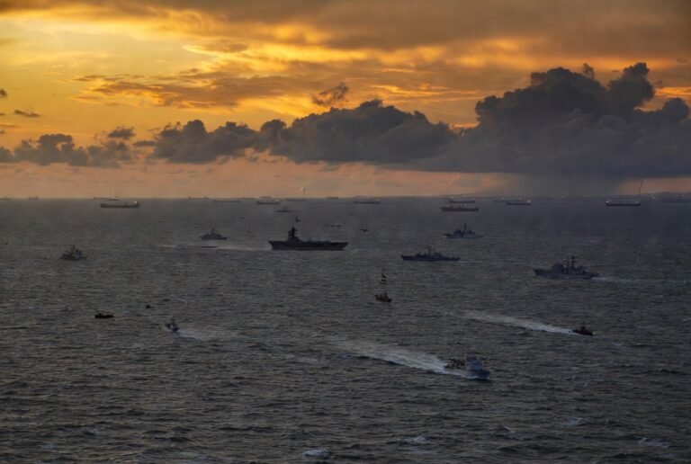 US-Iran military standoff in the Strait of Hormuz, April 2026 — aerial view of naval vessels in the Persian Gulf
