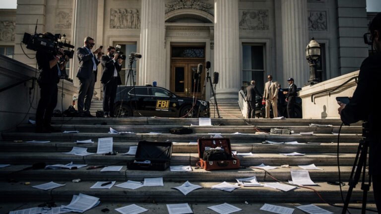 “Ultra-realistic federal courthouse scene in New Bern with legal documents, courthouse steps, journalists, and subtle FBI-related imagery in background, cinematic news photography style, 16:9”