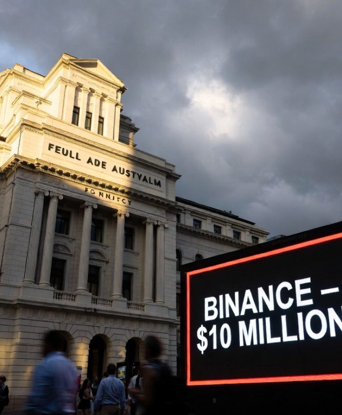 Binance fined $6.9 million Australia 2026 — Federal Court of Australia building in Sydney with digital display showing Binance ASIC penalty ruling, representing the Binance Australia derivatives case and global crypto regulation enforcement