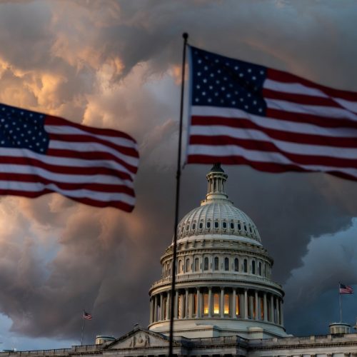 US Capitol building at dusk with dramatic skies representing 2026 midterm election political tensions