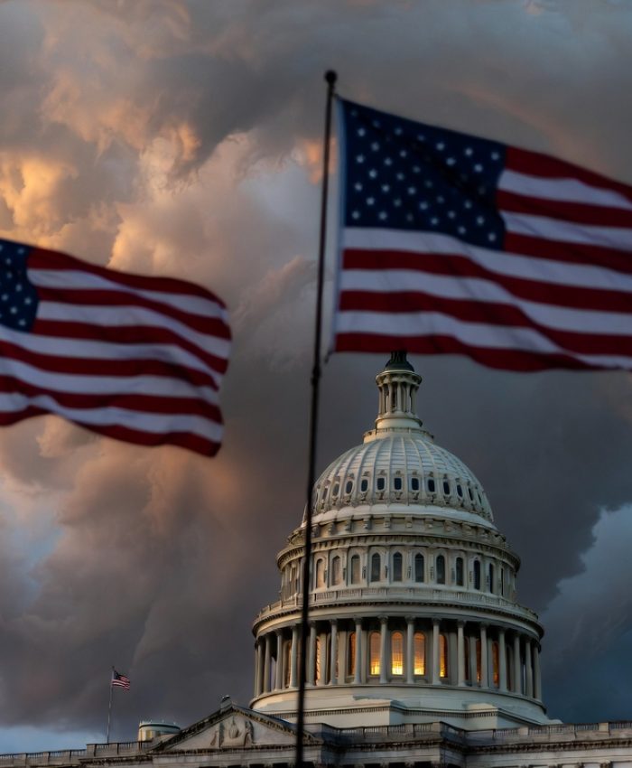 US Capitol building at dusk with dramatic skies representing 2026 midterm election political tensions